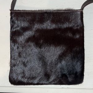 Bloomingdale’s deep brown cowhide crossbody.